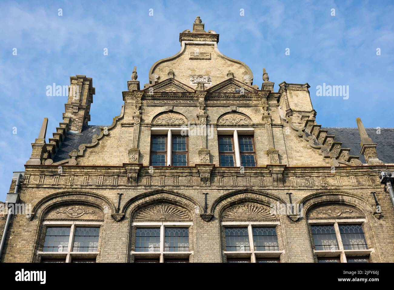 Typical step-gabled facades of medieval houses in Flanders, Belgium. These are on the market square of the 16th century market square in Veurne. Stock Photo