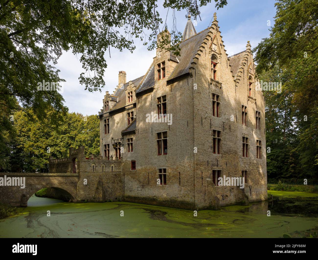 Hidden in a quiet park lies a beautiful medieval castle, built in the 16th century, in Flanders, Belgium Stock Photo