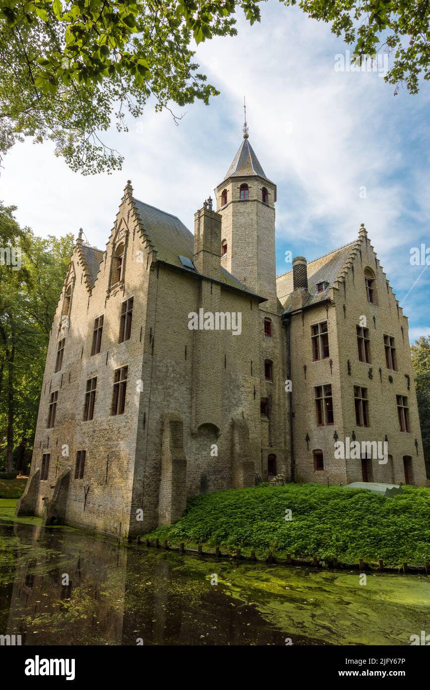 Hidden in a quiet park lies a beautiful medieval castle, built in the 16th century, in Flanders, Belgium Stock Photo