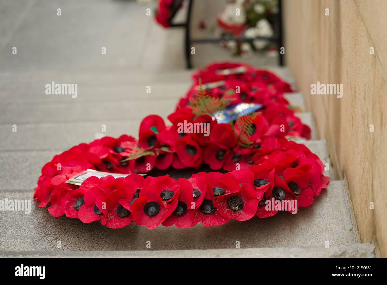 Red poppy wreaths at Menin Gate in Ypres, a memorial voor the fallen soldiers during WWI in Flanders Fields Stock Photo