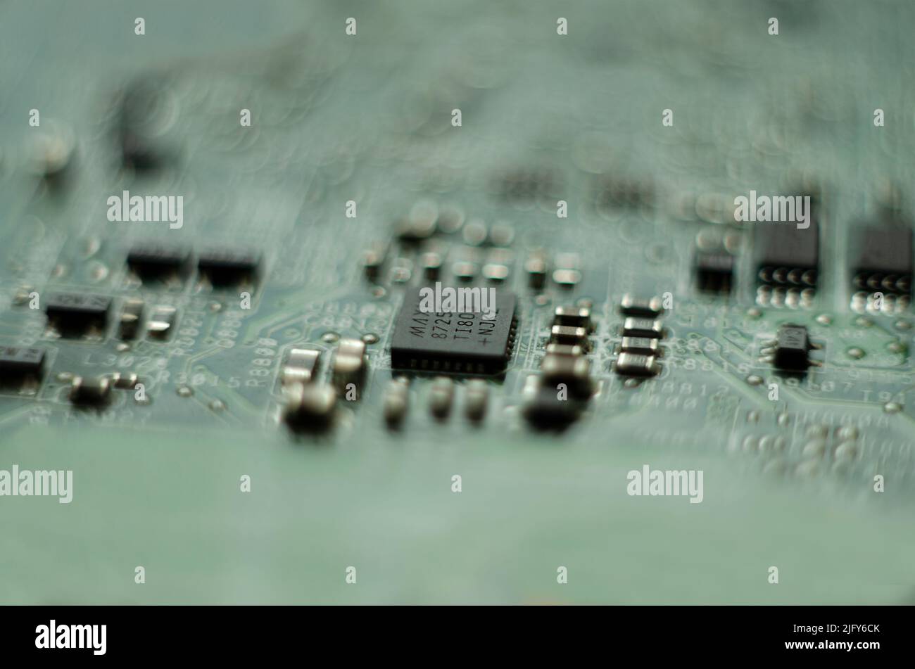Closeup on electronic board in hardware repair shop. Macro Stock Photo