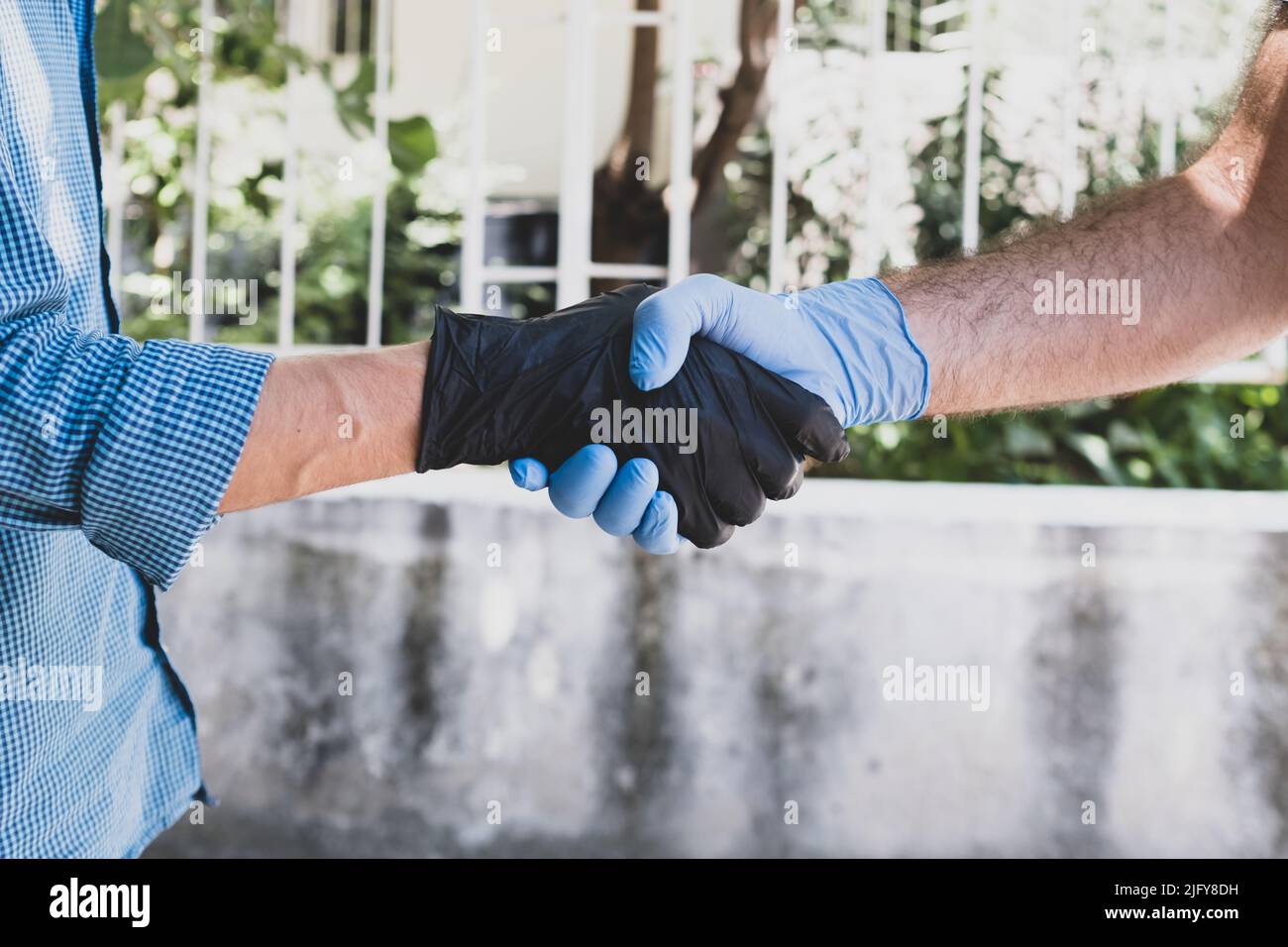 wearing gloves to stay away from smallpox. no contact. Stock Photo