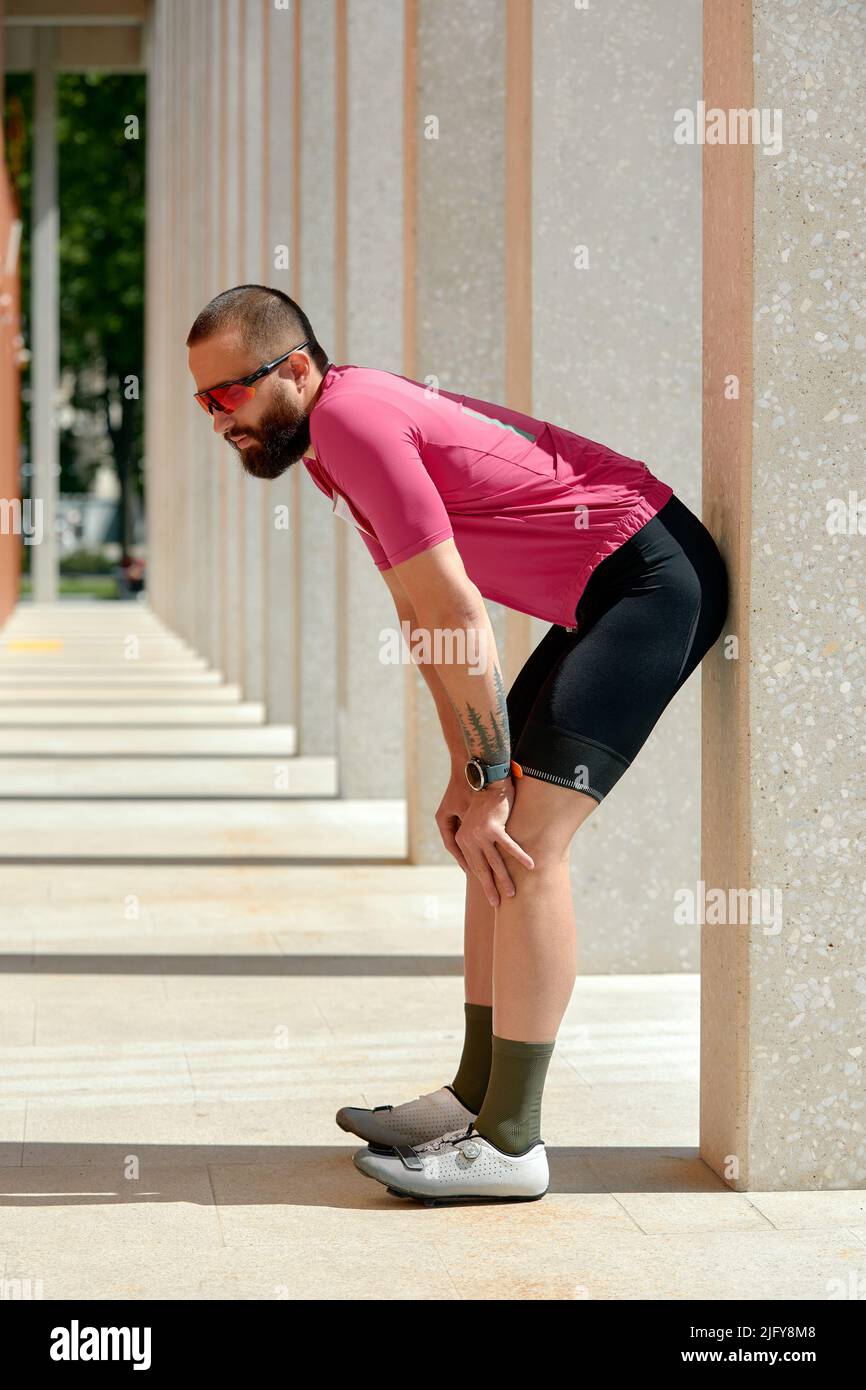 Portrait of a runner man take a rest after jogging while standing between  columns copy space area for your text message information, sportsman taking  Stock Photo - Alamy