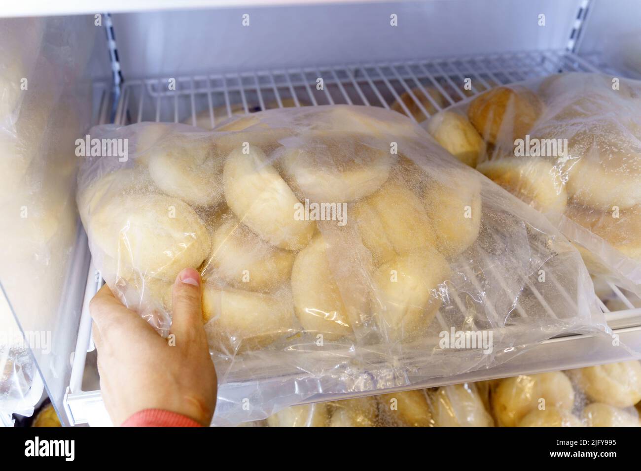 Frozen bread in the refrigerator, long life food storage concept Stock