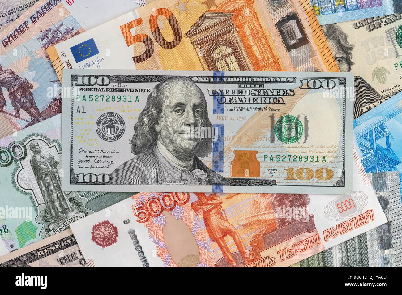 Money background from different countries: dollars, euros, rubles. International currencies. 100 dollars Stock Photo