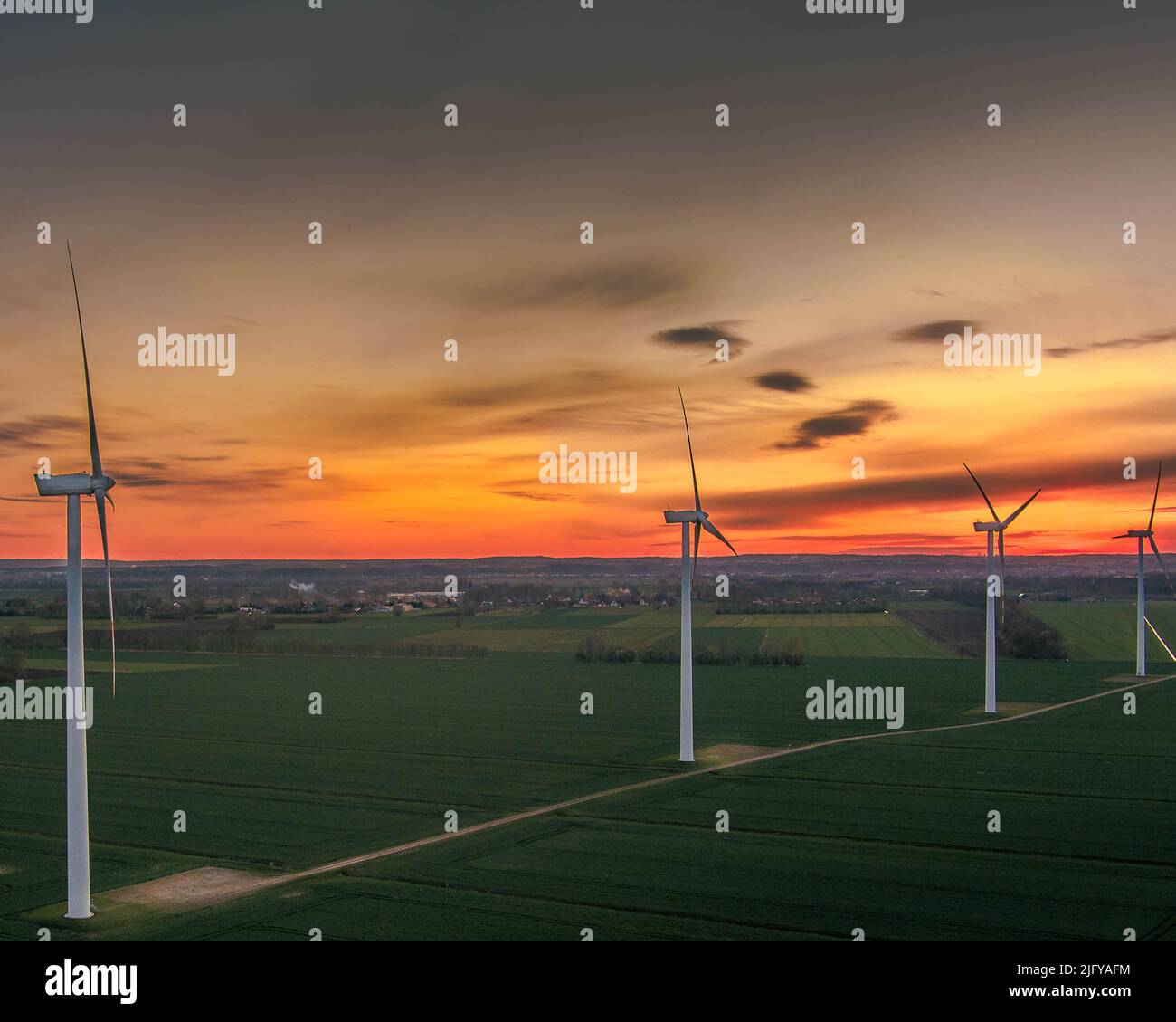 wind turbine farm at sunset Stock Photo