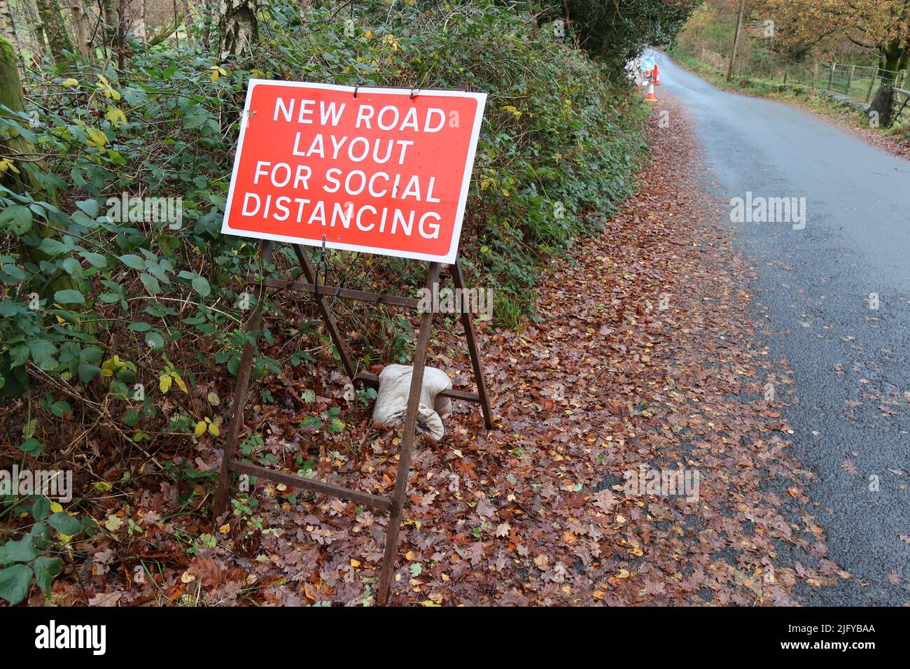 New road layout for social distancing sign. The Cumbria Way Long-distance trail. Lake district national park. England. UK Stock Photo