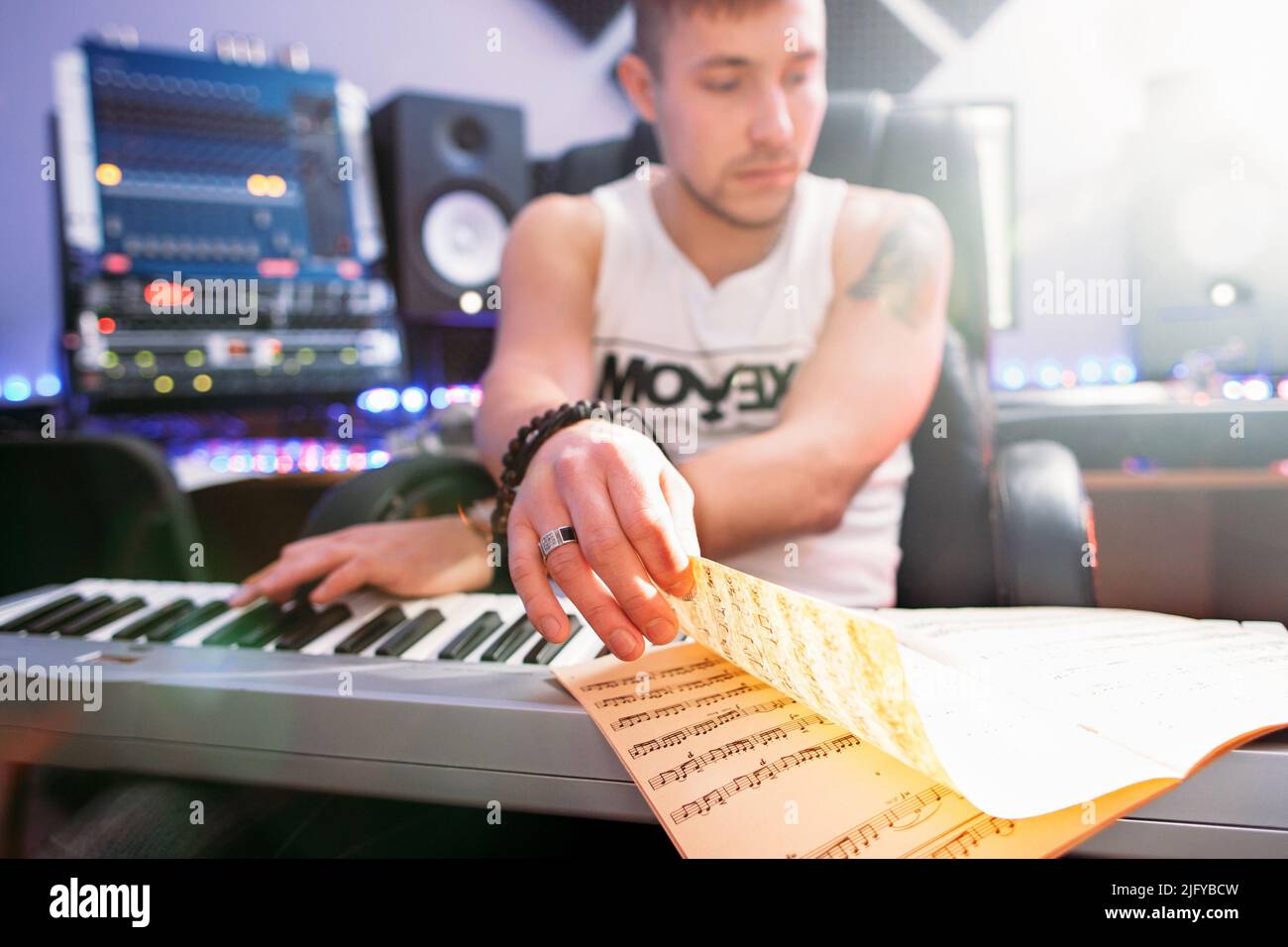 DJ create piano music in recording studio Stock Photo