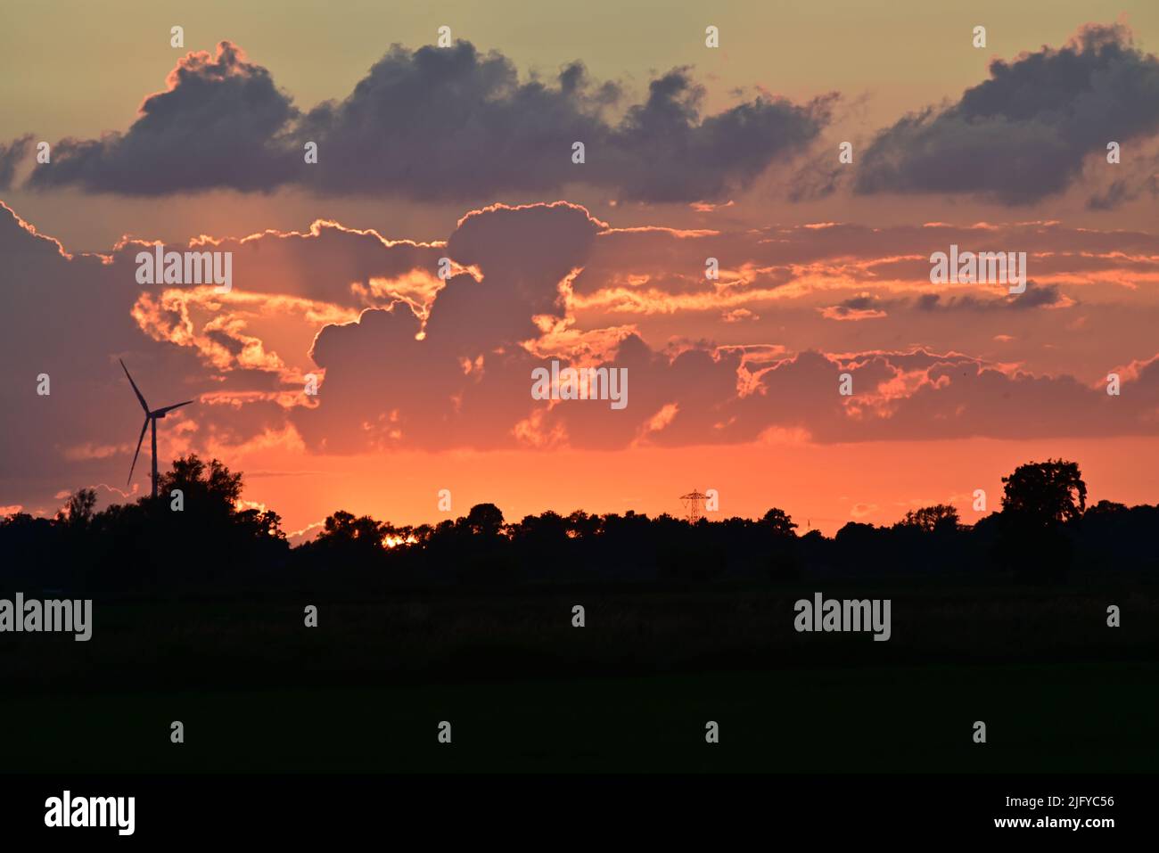Colourful dramatic sky with clouds during sunset Stock Photo - Alamy