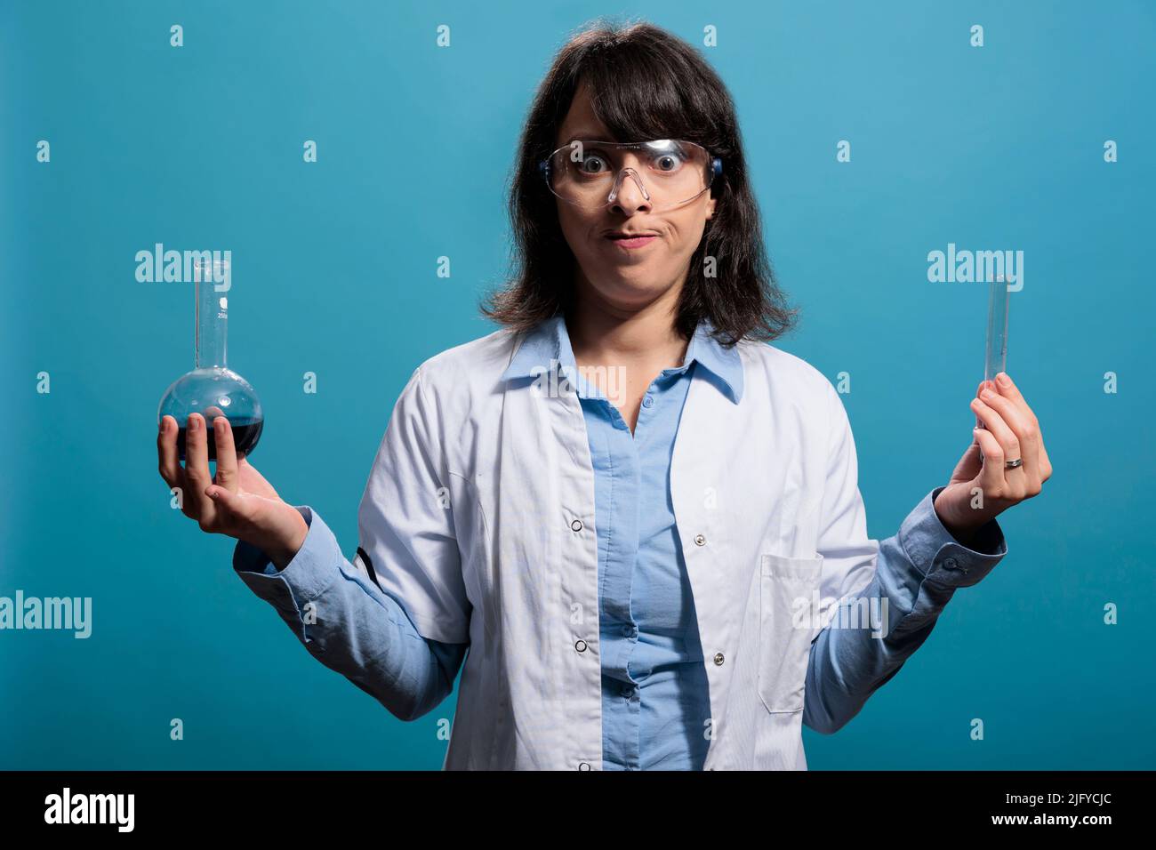 Angry upset biochemistry expert holding laboratory professional glass ...
