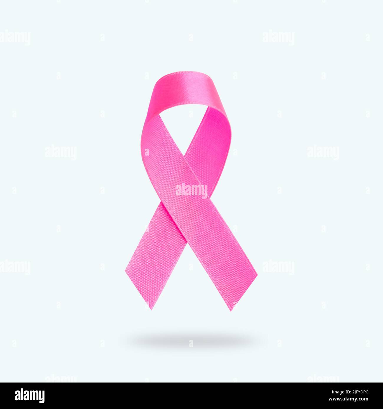 Breast Cancer concept : Pink ribbon isolated on white background Stock Photo