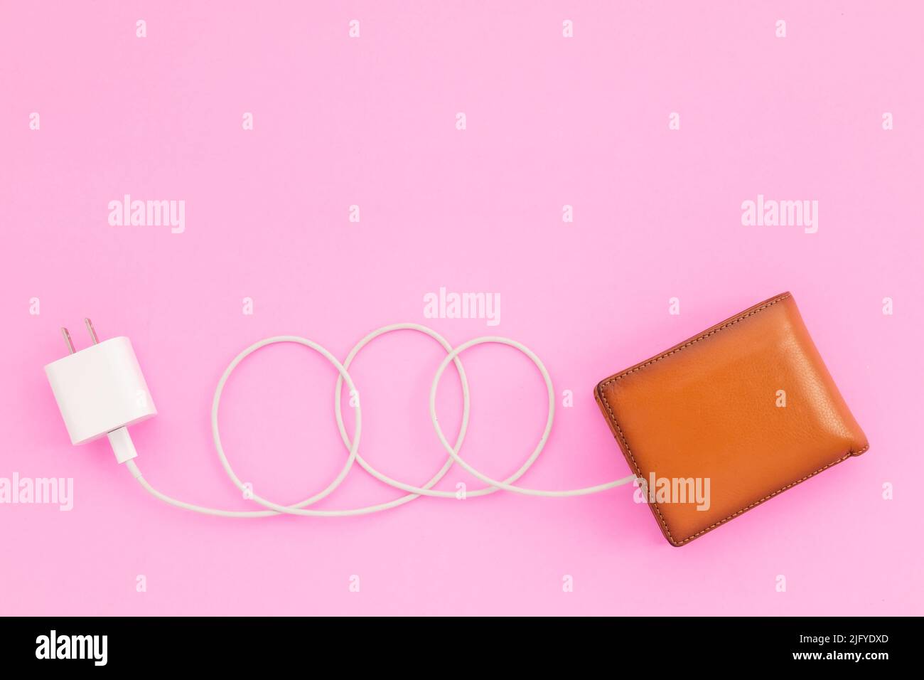 Charging the power to financial concept : Top view white charger cable ...