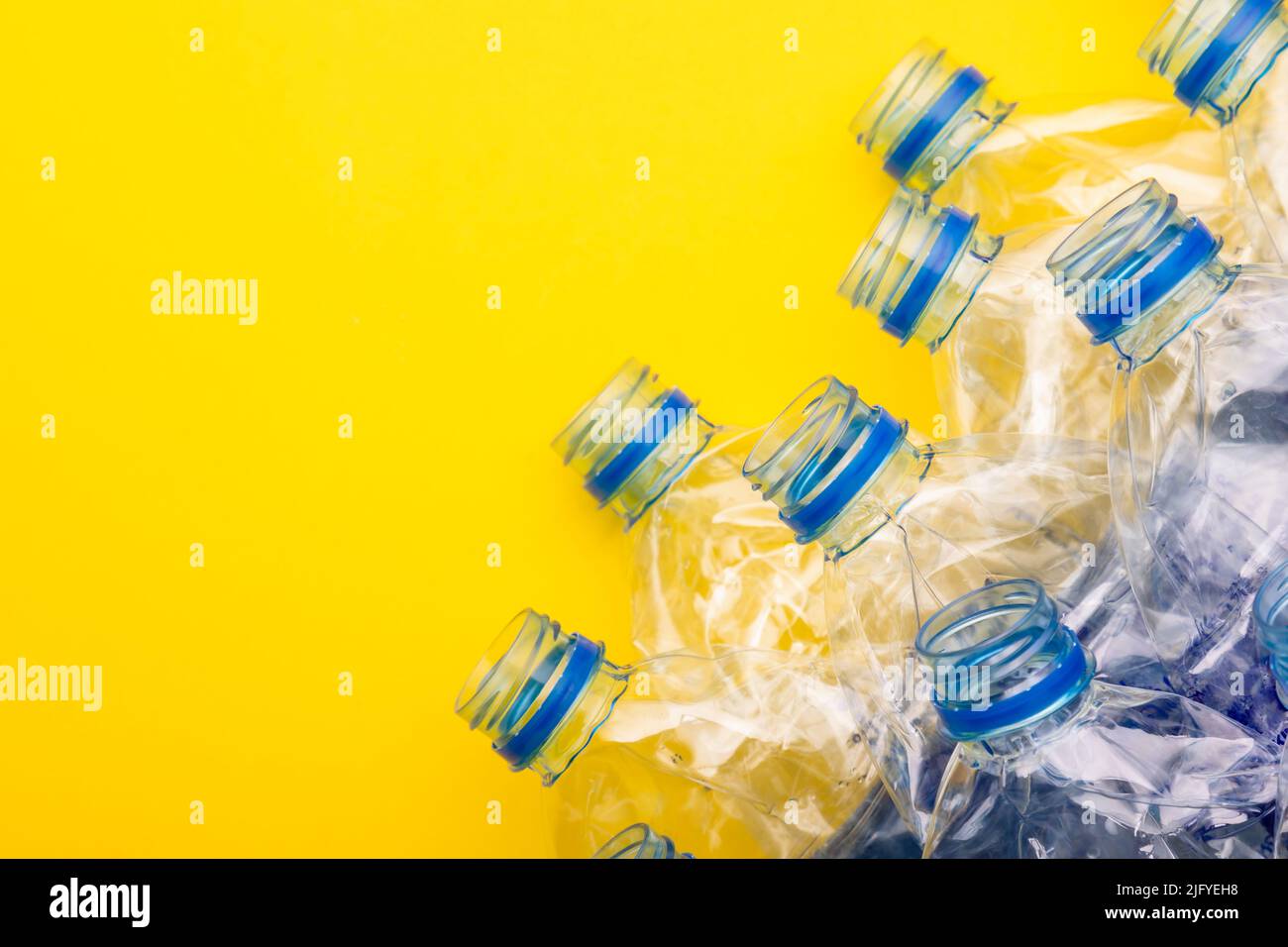 Mineral Water Small Plastic Bottles Yellow Background Top View Flat Stock  Photo by ©leszekczerwonka 403720658