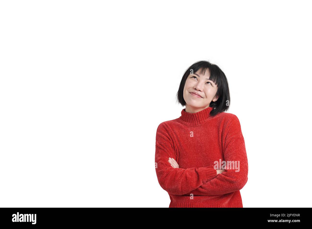 Young asian woman wearing red sweater smiling and thinking, isolated. Stock Photo