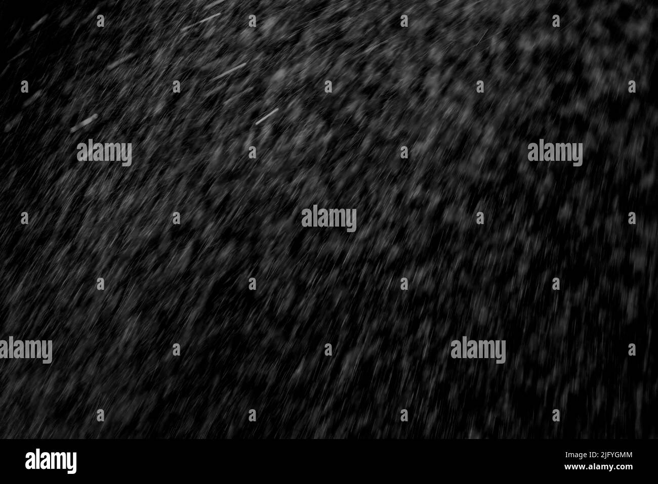 Abstract splashes of Rain and white particles on black background Stock ...