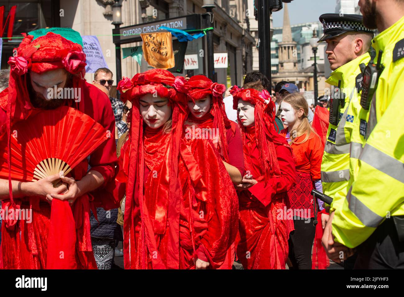 Red Brigade parade at the Extinction Rebellion demonstration, Oxford Circus, London, in protest of world climate breakdown and ecological collapse. Stock Photo