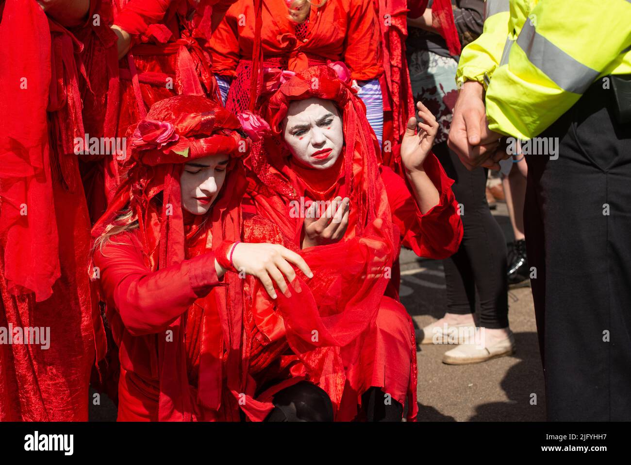 Red Brigade parade at the Extinction Rebellion demonstration, Oxford Circus, London, in protest of world climate breakdown and ecological collapse. Stock Photo