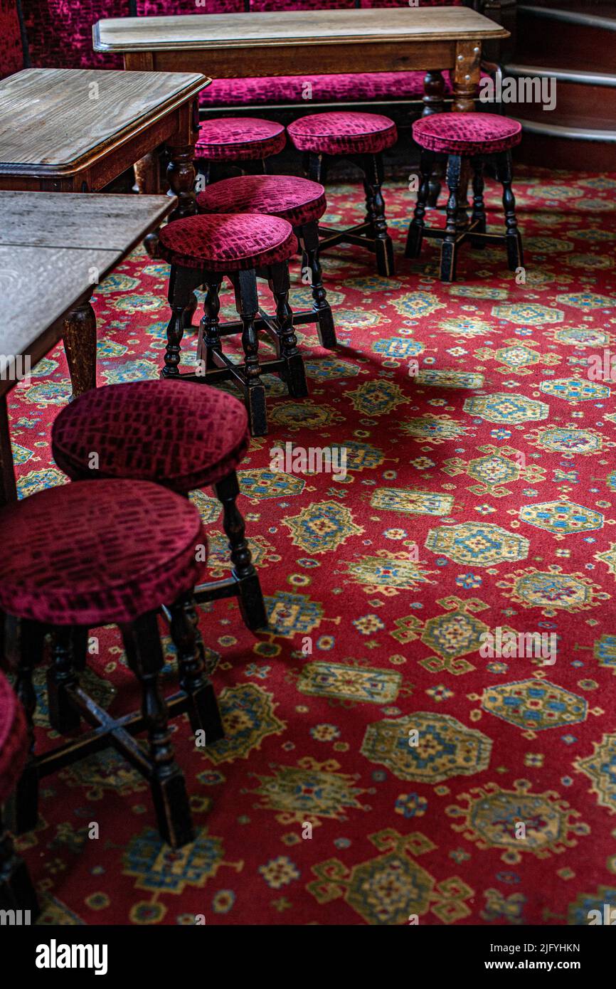 Pub stools at the Cockpit pub in St Andrew's Hill in the City of London. Stock Photo