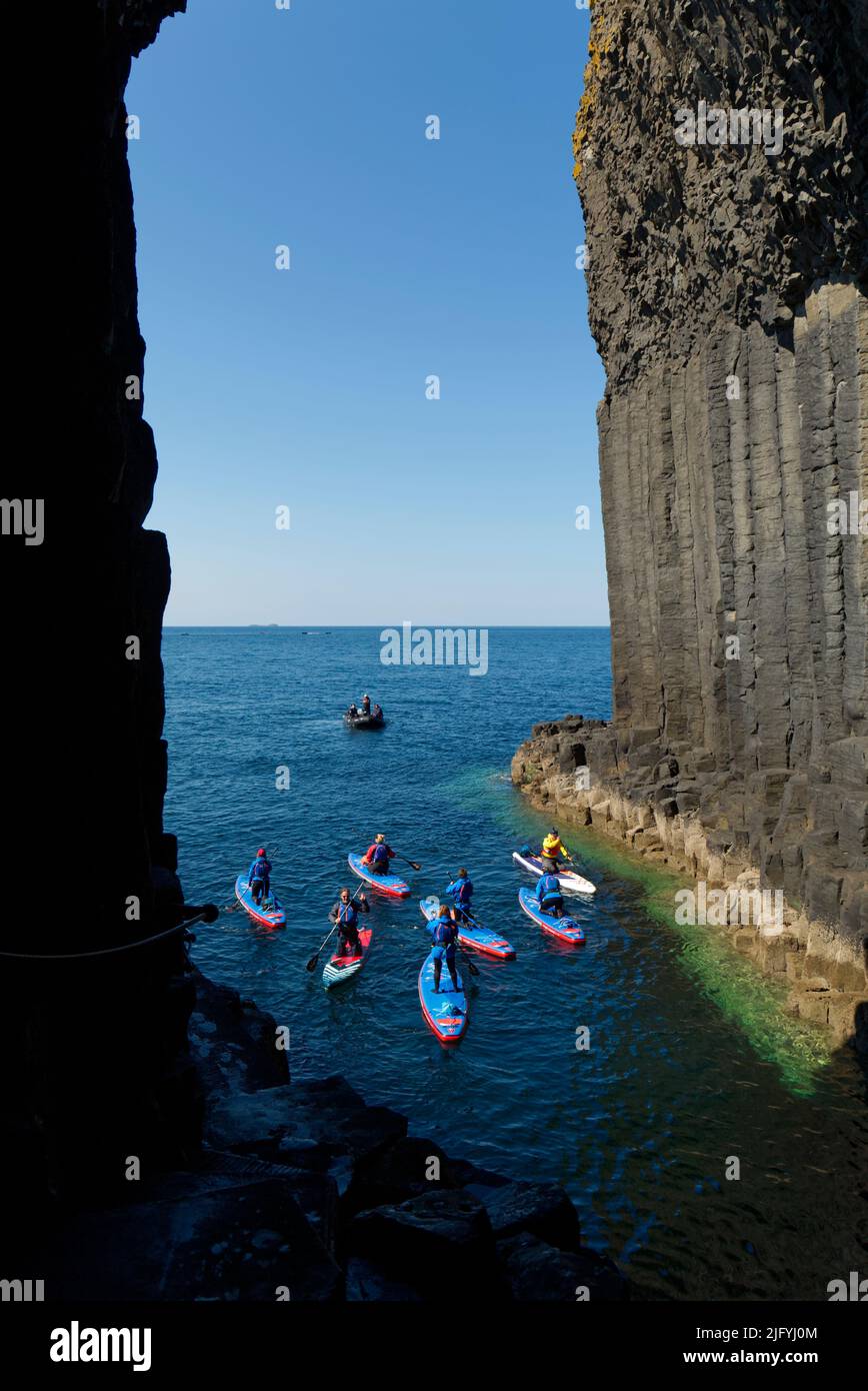 Paddle boarders at Fingals Cave, Staffa Island Stock Photo