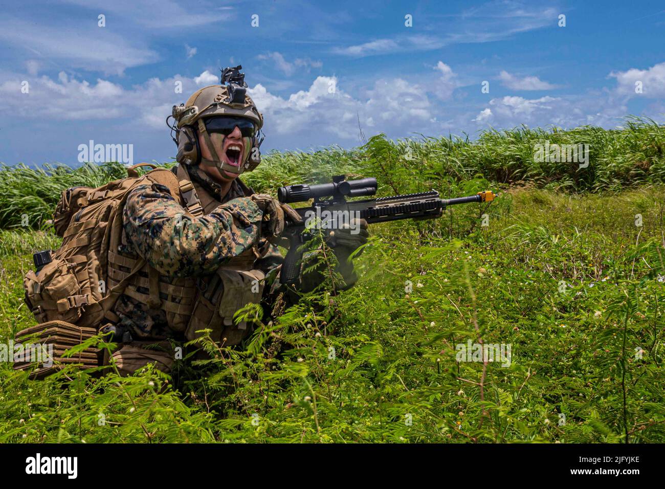Camp Hansen, Okinawa, Japan. 28th June, 2022. U.S. Marine Corps Lance Cpl. Dali Miranda, an infantry Marine with Battalion Landing Team 2/5, 31st Marine Expeditionary Unit, posts security during a helicopter raid training exercise on Ie Shima, Okinawa, Japan, June 28, 2022. The training exercise consisted of Marines taking control of a known location to establish a Forward Arming and Refueling Point. The 31st MEU, the Marine Corps' only continuously forward-deployed MEU, provides a flexible and lethal force ready to perform a wide range of military operations as the premiere crisis response Stock Photo