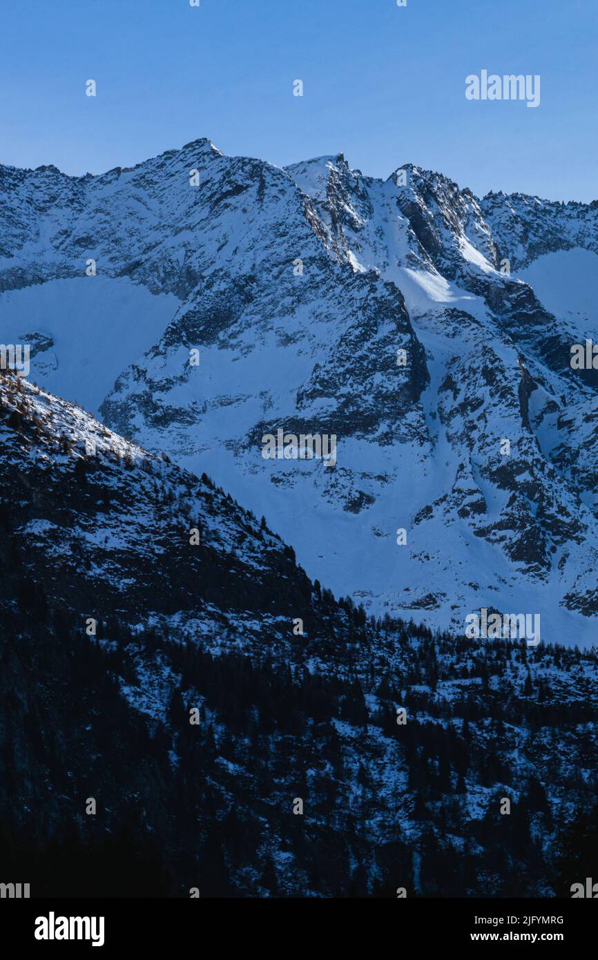 The snow-capped mountains, glaciers and woods of Val Camonica during the first days of January, near the town of Ponte di Legno, Italy - January 2022. Stock Photo