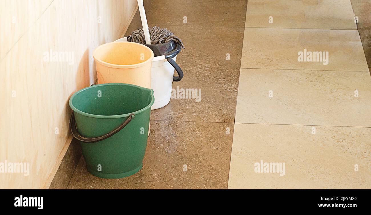 a mop with the bucket and two buckets for washing the floor Stock Photo