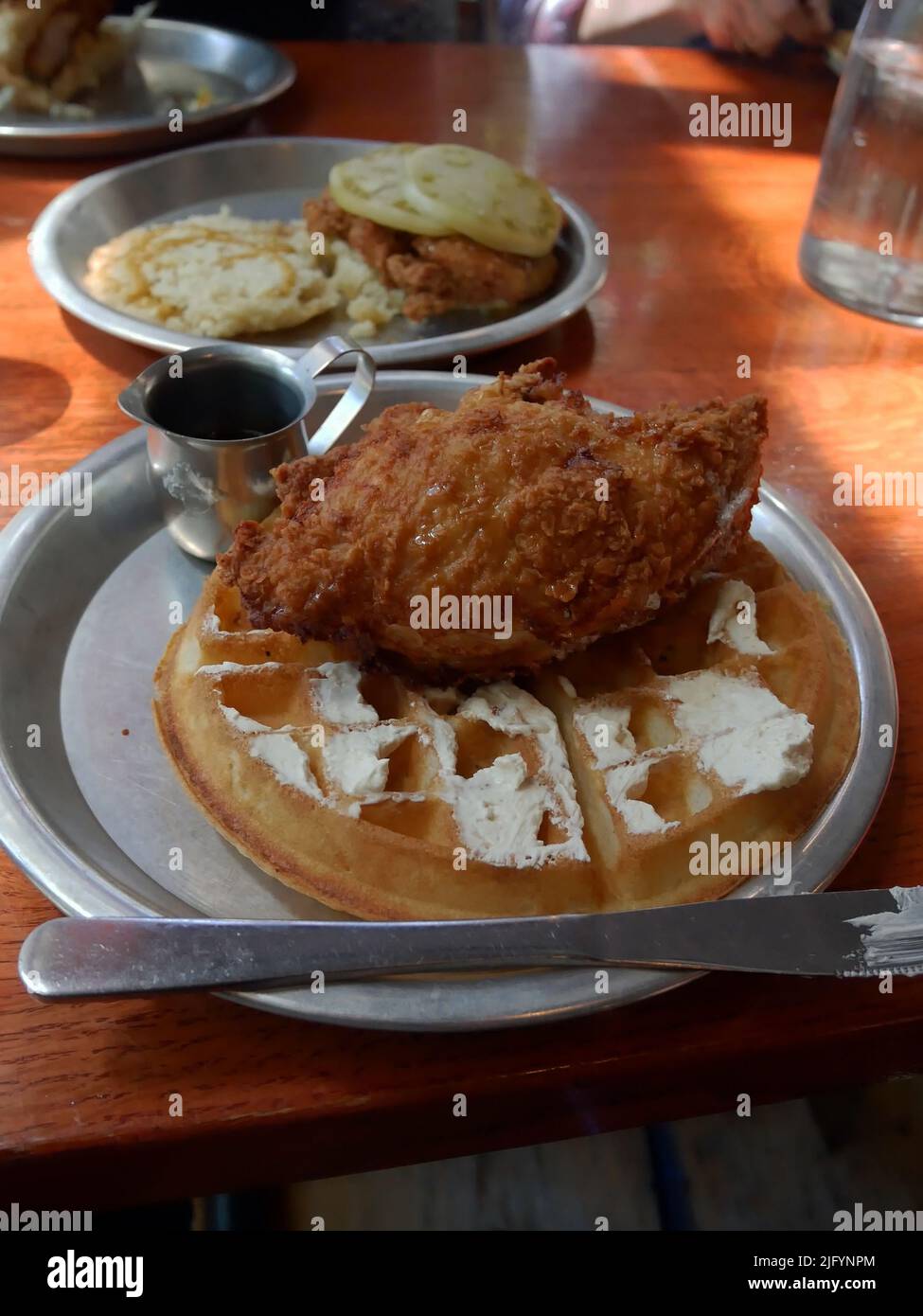 Fried chicken on a waffle. Stock Photo
