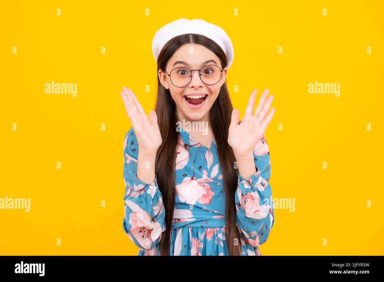 Excited kids face. Amazed expression, cheerful and glad. Amazed child with  open mouth on yellow background, surprise Stock Photo - Alamy
