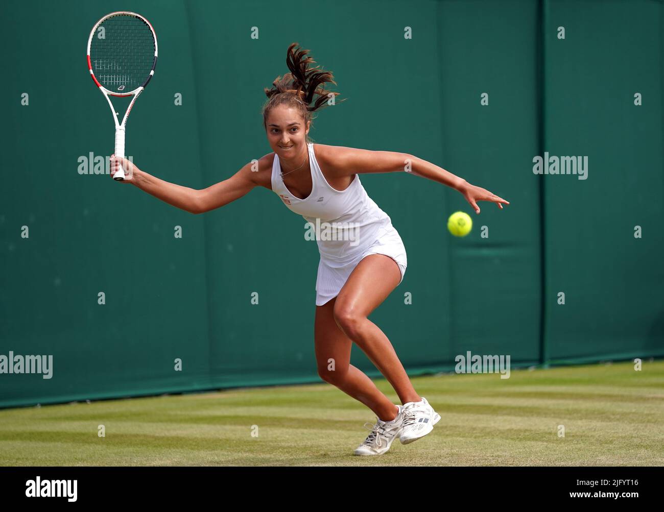 Jasmine Conway in action against Hayu Kinoshita during the gilrs singles on day ten of the 2022 Wimbledon Championships at the All England Lawn Tennis and Croquet Club, Wimbledon