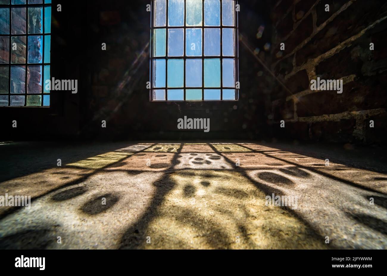 Clock Window Pattern Colorful patterns of a light coming through the frosted stained window ...