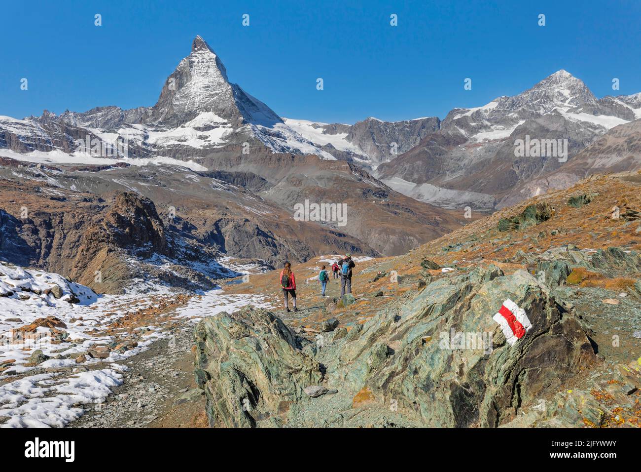 Hikers on Gornergrat, Matterhorn Peak, 4478m, Zermatt, Valais, Swiss Alps, Switzerland, Europe Stock Photo