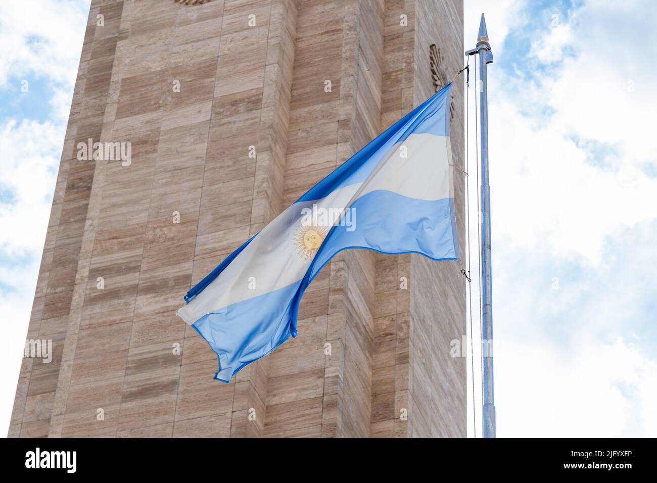National Flag Monument. View of the waving Argentinian Flag and the main tower in the background. Stock Photo