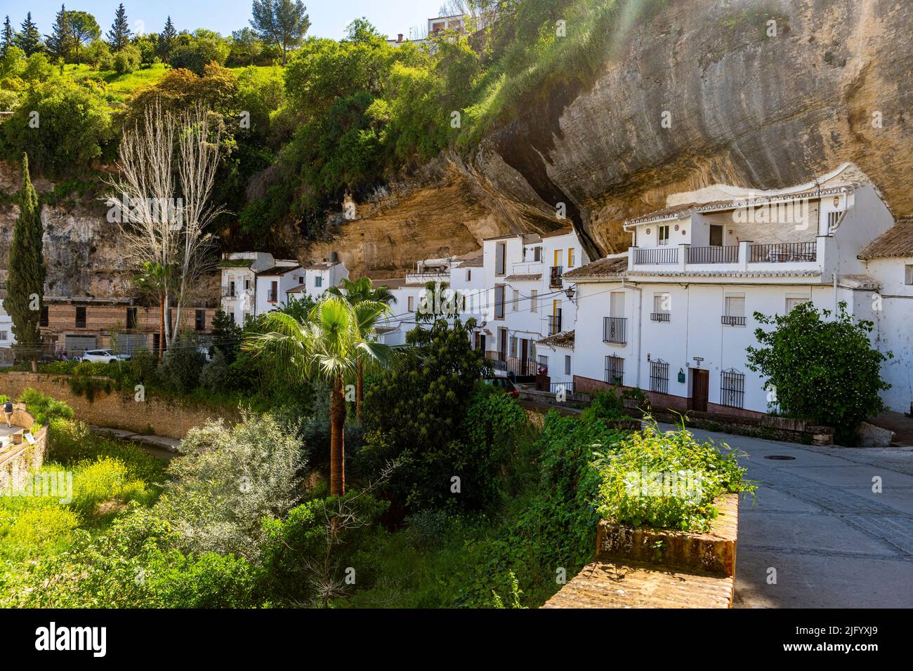 Dwellings built into rock overhangs above the Rio Guadalporcun, Setenil de las Bodegas, Andalucia, Spain, Europe Stock Photo