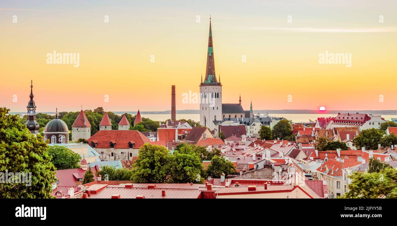 View over the Old Town towards St. Olaf's Church at sunrise, UNESCO World Heritage Site, Tallinn, Estonia, Europe Stock Photo