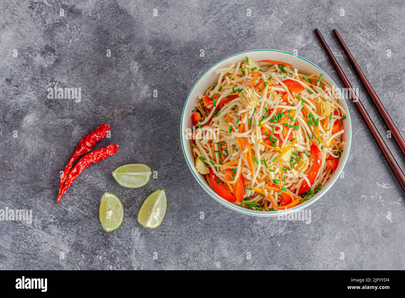 Vegetable Chow Mein with Red Bell Pepper, Baby Corn, Top Down Photo Stock Photo