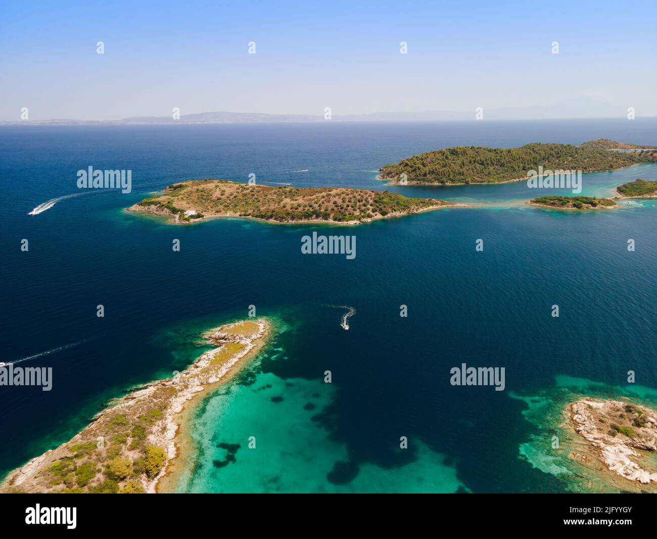 Drone shot above Sithonia, Chalkidiki peninsula, with small islands and clear waters, Crete, Greek Islands, Greece, Europe Stock Photo