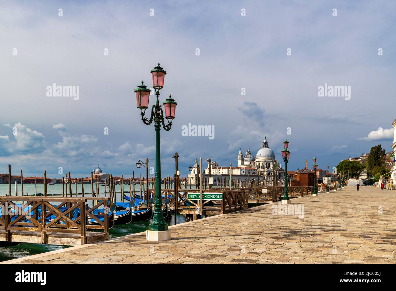 The Riva degli Schiavoni with typical green street lamps and gondola moorings, Venice, UNESCO World Heritage Site, Veneto, Italy, Europe Stock Photo