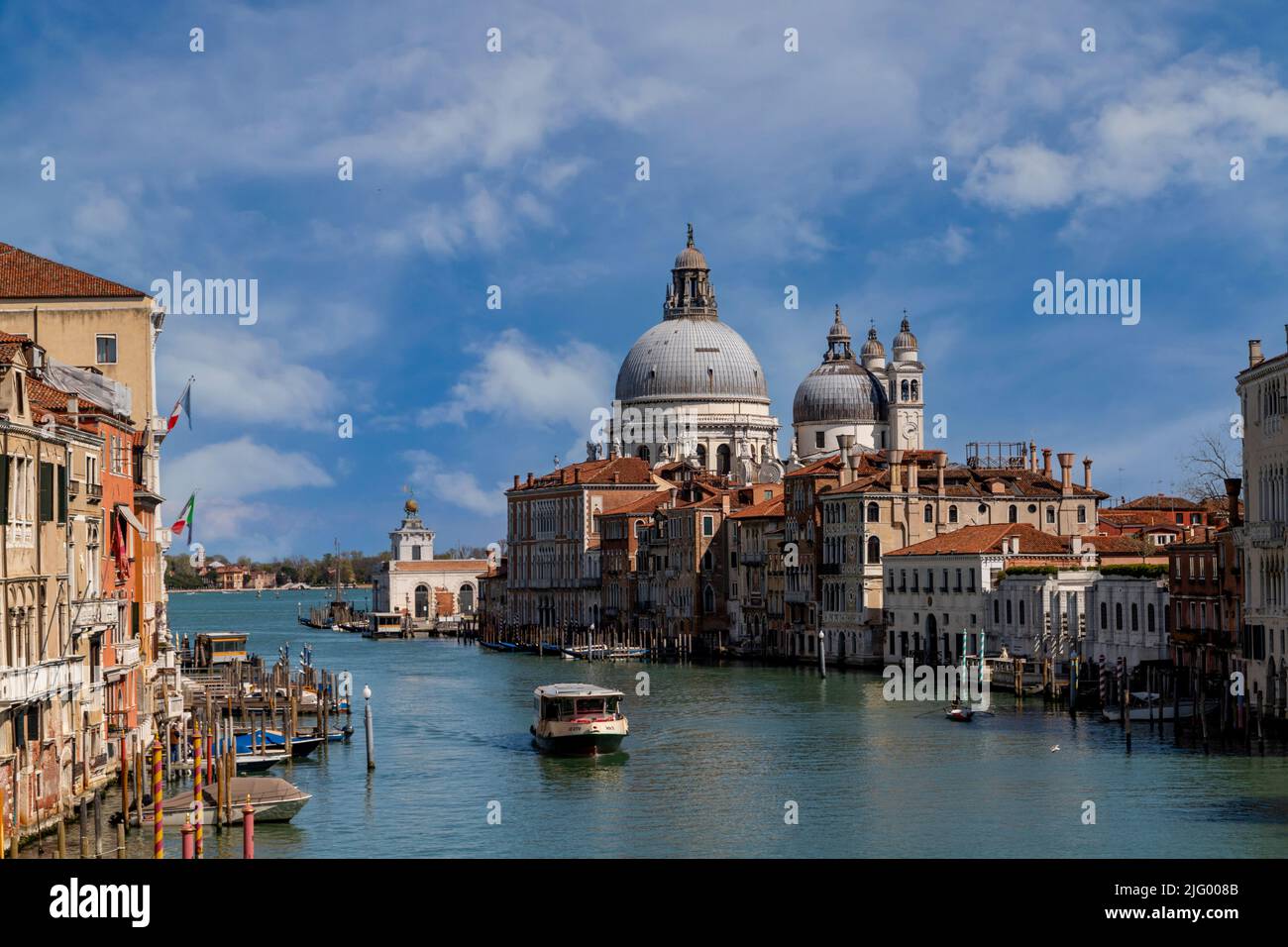 View of the Grand Canal with the Basilica of Santa Maria della Salute in the background, Venice, UNESCO World Heritage Site, Veneto, Italy, Europe Stock Photo