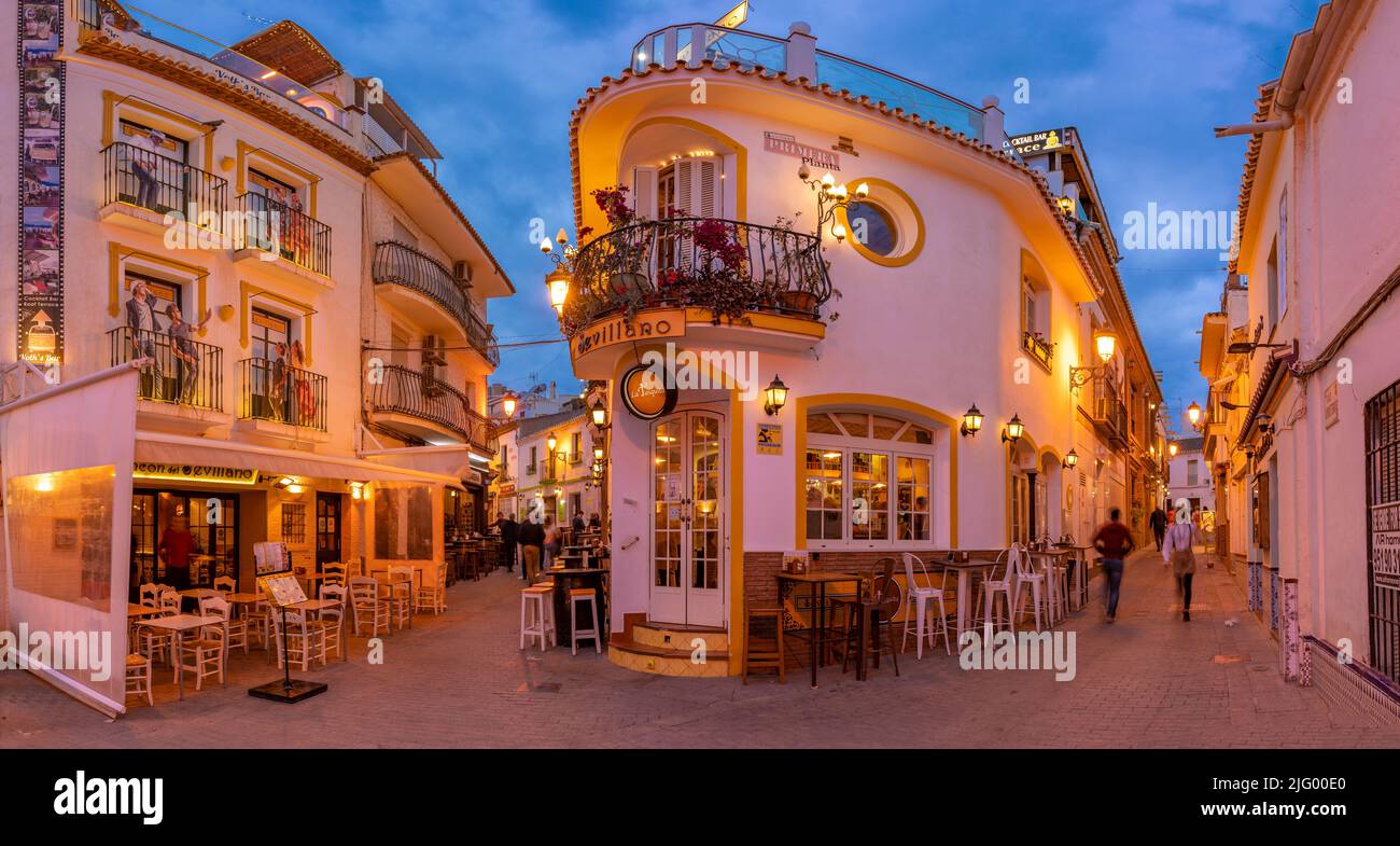 View of cafe and restaurant in the old town of Nerja at dusk, Nerja, Costa del Sol, Malaga Province, Andalusia, Spain, Mediterranean, Europe Stock Photo