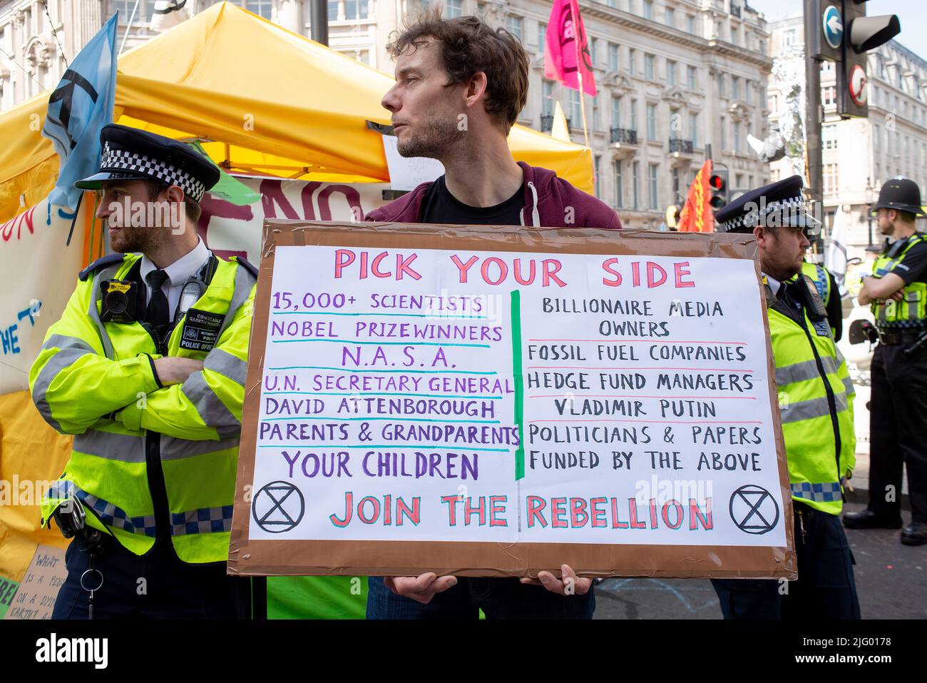 Climate change protester& police at the Extinction Rebellion demonstration, London, in protest of world climate breakdown and ecological collapse. Stock Photo