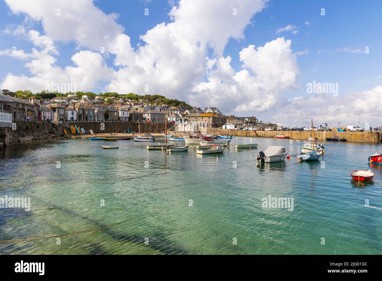 Mousehole harbour at high tide Stock Photo