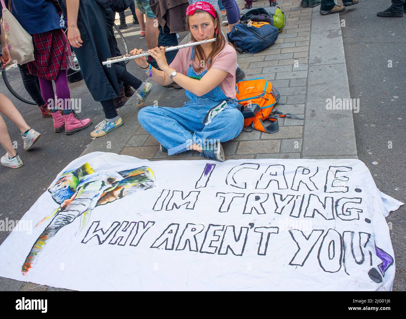 Climate change protesters with signs at the Extinction Rebellion demonstration, London, in protest of world climate breakdown and ecological collapse. Stock Photo