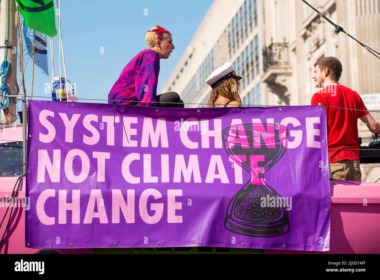 Climate change protesters with signs at the Extinction Rebellion demonstration, London, in protest of world climate breakdown and ecological collapse. Stock Photo