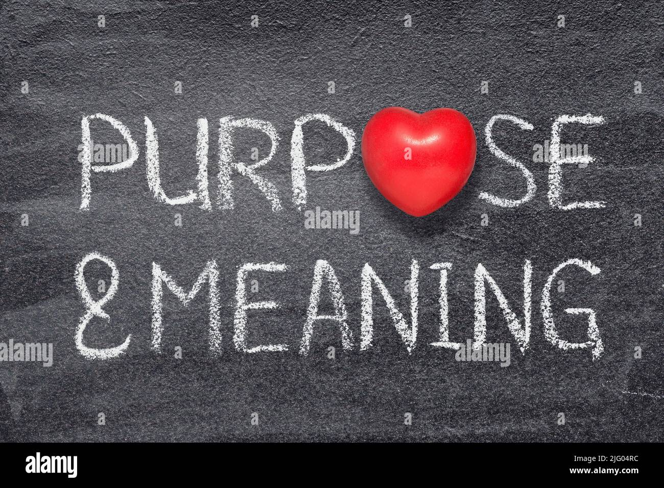 purpose and meaning words written on chalkboard with red heart symbol Stock Photo