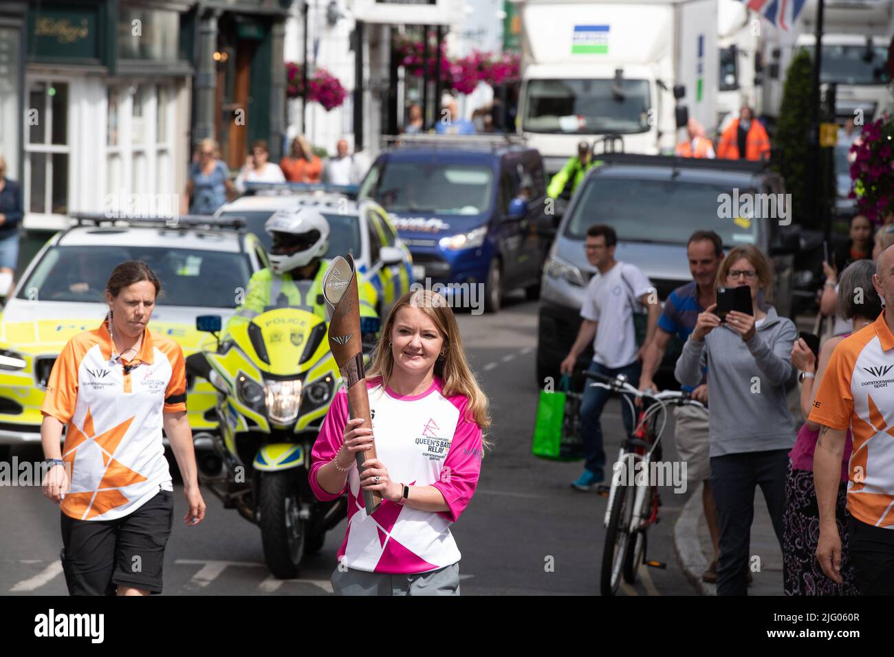 Eton, Windsor, Berkshire, UK. 6th July, 2022. Judo Olympian Ray Stevens carried the baton in Windsor. The Birmingham 2022 Queen's Baton Relay came to Eton High Street and Windsor Bridge this morning. The convoy are travelling to the Isle of Wight next. Credit: Maureen McLean/Alamy Live News. 6th July, 2022. The Birmingham 2022 Queen's Baton Relay came to Eton High Street and Windsor Bridge this morning. The convoy are travelling to the Isle of Wight next. Credit: Maureen McLean/Alamy Live News 6th July, 2022. A Police escort for The Birmingham 2022 Queen's Baton Relay which came to Eton High S Stock Photo
