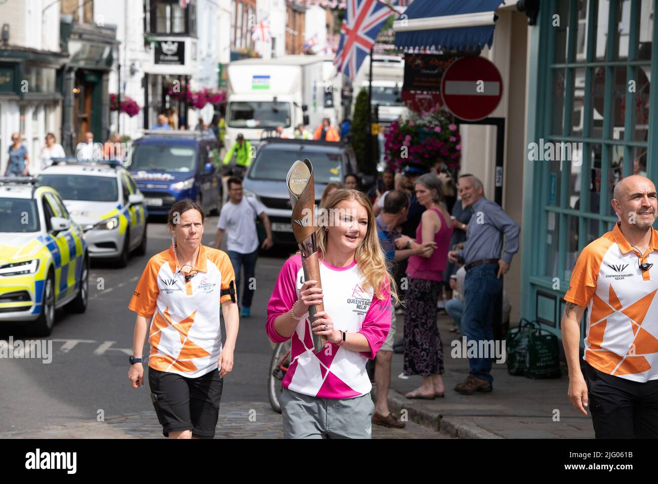 Eton, Windsor, Berkshire, UK. 6th July, 2022. Judo Olympian Ray Stevens carried the baton in Windsor. The Birmingham 2022 Queen's Baton Relay came to Eton High Street and Windsor Bridge this morning. The convoy are travelling to the Isle of Wight next. Credit: Maureen McLean/Alamy Live News. 6th July, 2022. The Birmingham 2022 Queen's Baton Relay came to Eton High Street and Windsor Bridge this morning. The convoy are travelling to the Isle of Wight next. Credit: Maureen McLean/Alamy Live News 6th July, 2022. A Police escort for The Birmingham 2022 Queen's Baton Relay which came to Eton High S Stock Photo