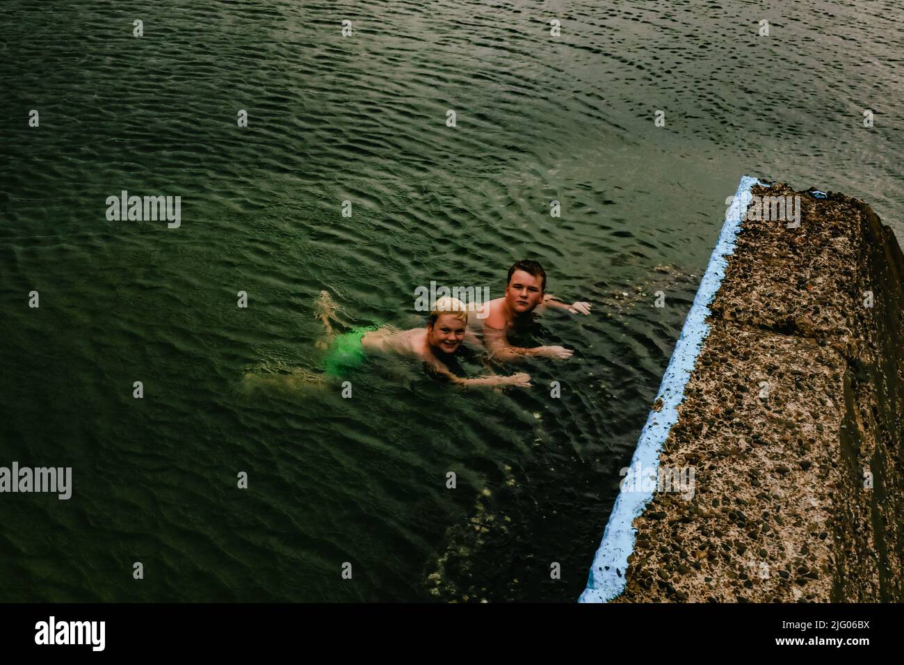Kids swimming in the Ocean Baths swimming pool at Forster, New South