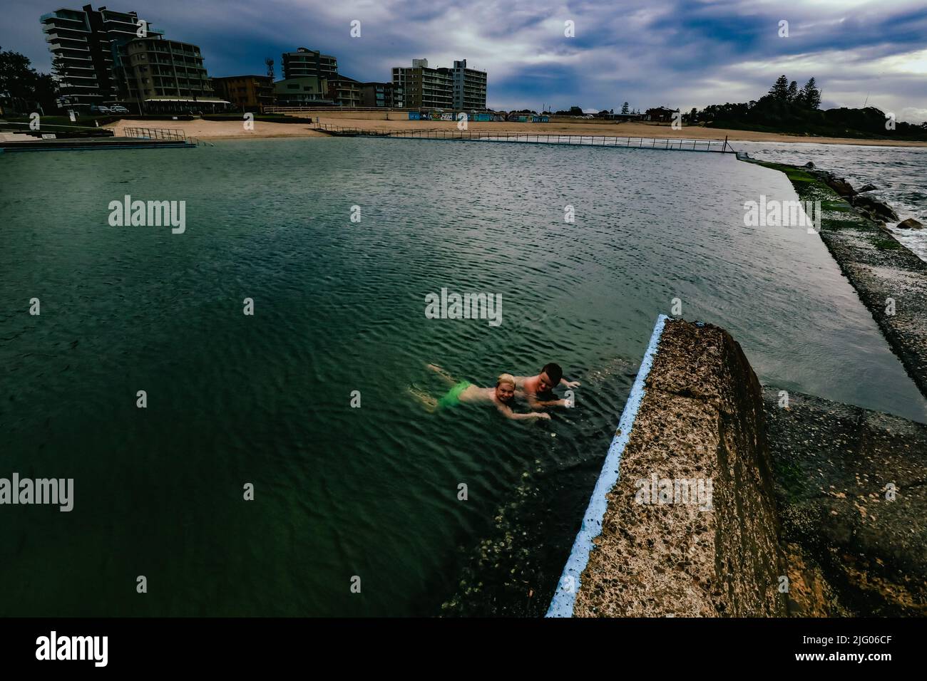 Kids swimming in the Ocean Baths swimming pool at Forster, New South
