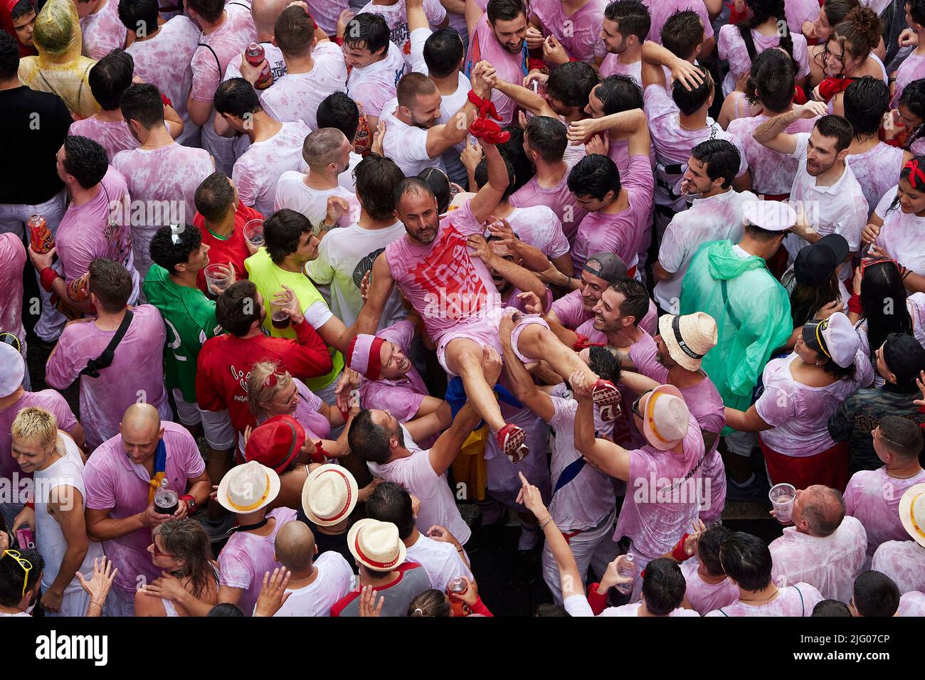Pamplona, Spain. 06th July, 2022. Revellers enjoy the atmosphere during the opening day or 'Chupinazo' of the San Fermin Running of the Bulls fiesta on July 06, 2022 in Pamplona, Spain. The annual Fiesta de San Fermin, made famous by the 1926 novel of US writer Ernest Hemmingway entitled 'The Sun Also Rises', involves the daily running of the bulls through the historic heart of Pamplona to the bull ring. (Photo by Ruben Albarran / PRESSINPHOTO) Credit: PRESSINPHOTO SPORTS AGENCY/Alamy Live News Stock Photo