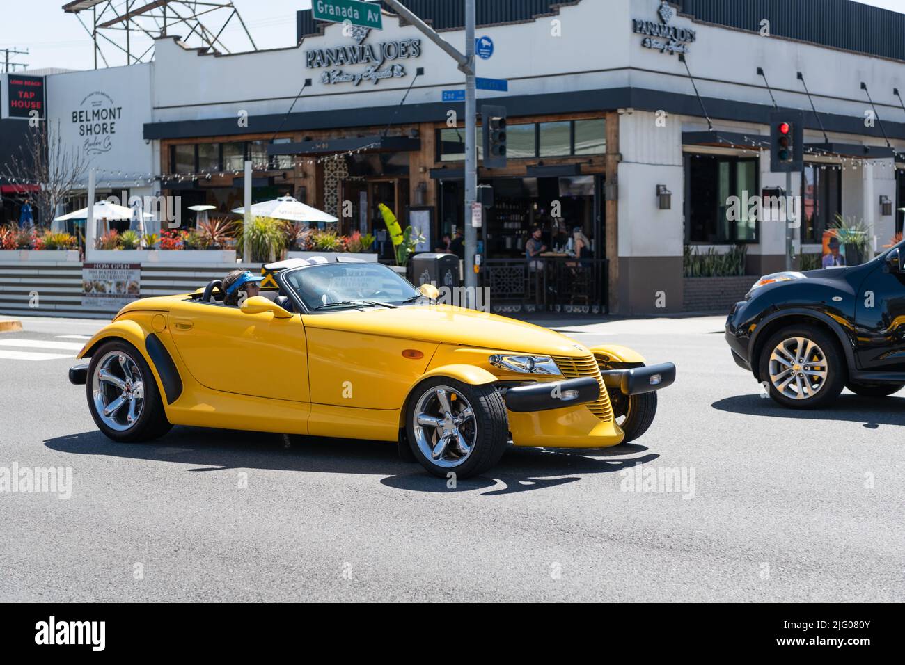 Long Beach, California USA - March 31, 2021: classic car of yellow Chrysler Plymouth Prowler on road Stock Photo